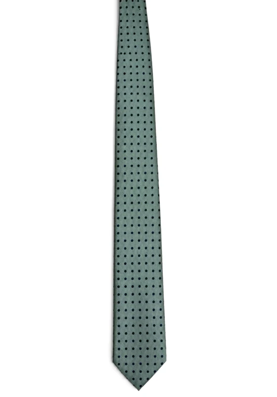 Corbata verde con lunares negros